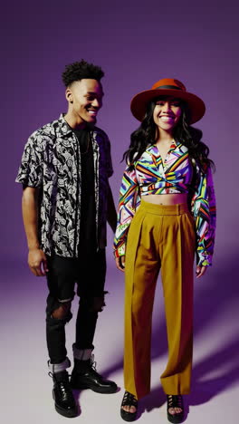 vibrant studio portrait of a stylish couple