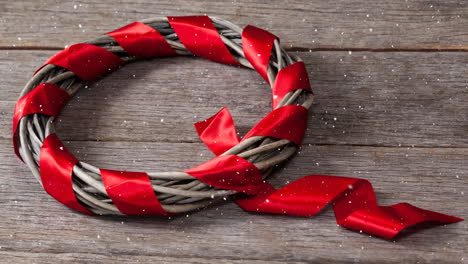 falling snow with christmas wreath decoration