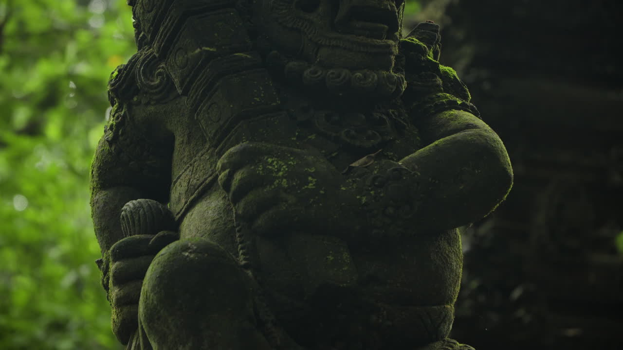 Closeup Of Mossy Balinese Statue At Sacred Monkey Forest Sanctuary In Bali, Indonesia