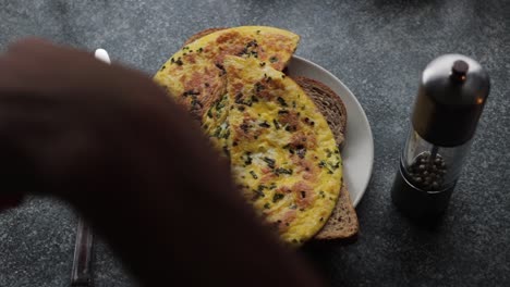 warm omelets being put on brown sandwiches!