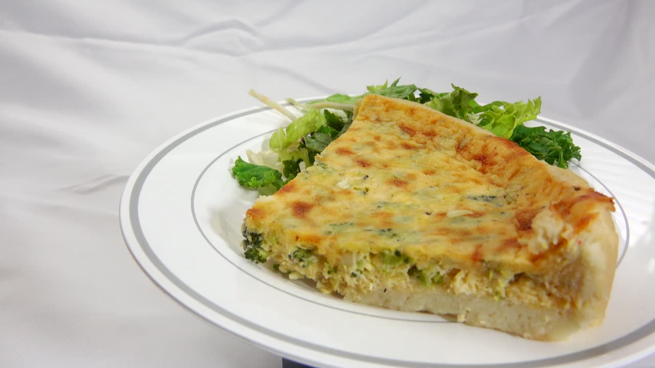 Savory broccoli quiche delight featuring fresh broccoli florets baked into a creamy egg filling creating a wholesome flavorful dish perfect for breakfast brunch or anytime enjoyment
