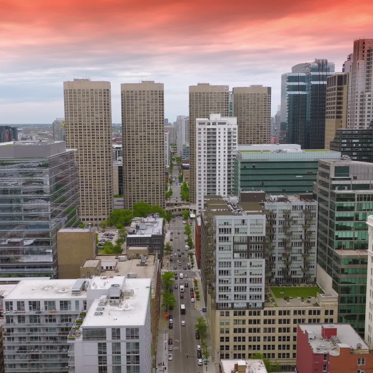 Urban architecture of beautiful Chicago, Illinois at daytime. Modern buildings at the backdrop of fantastic pink skies