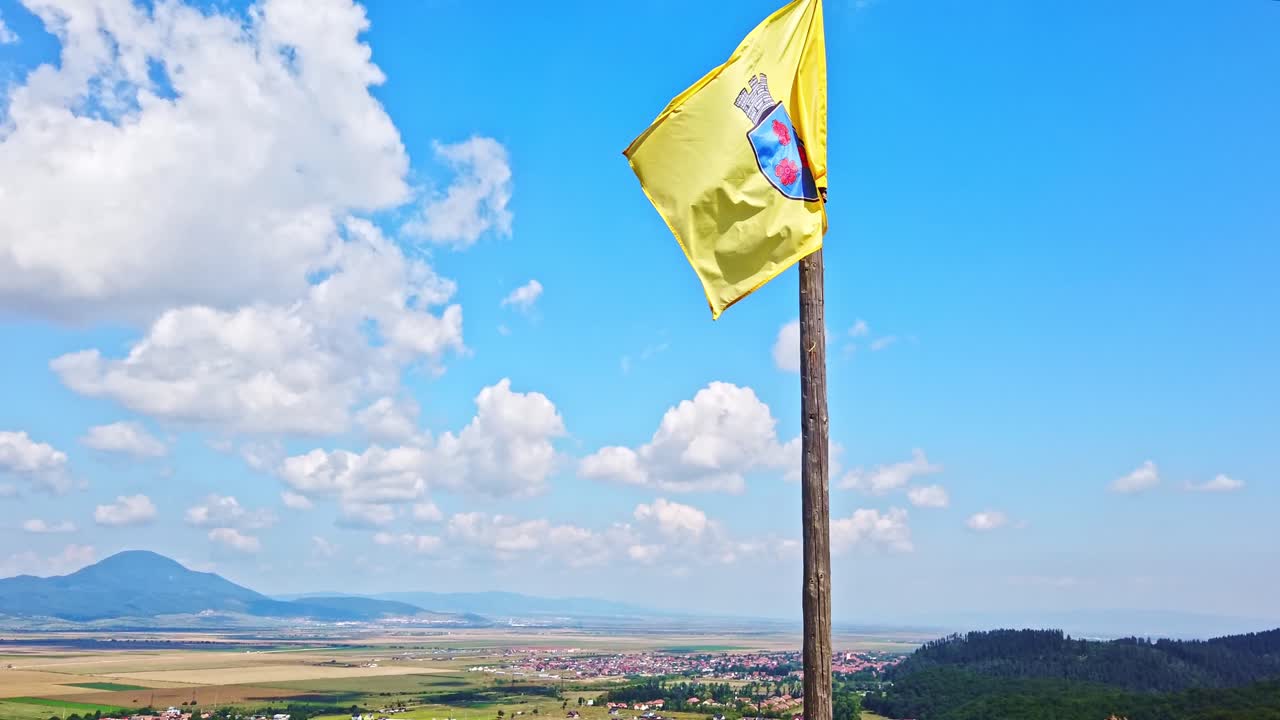 Rasnov flag blowing in the air in Brasov
