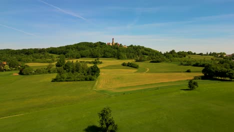 4k aerial drone video of the farmland around the historic bamberg castle on the edge of bamberg, germany on a beautiful spring day