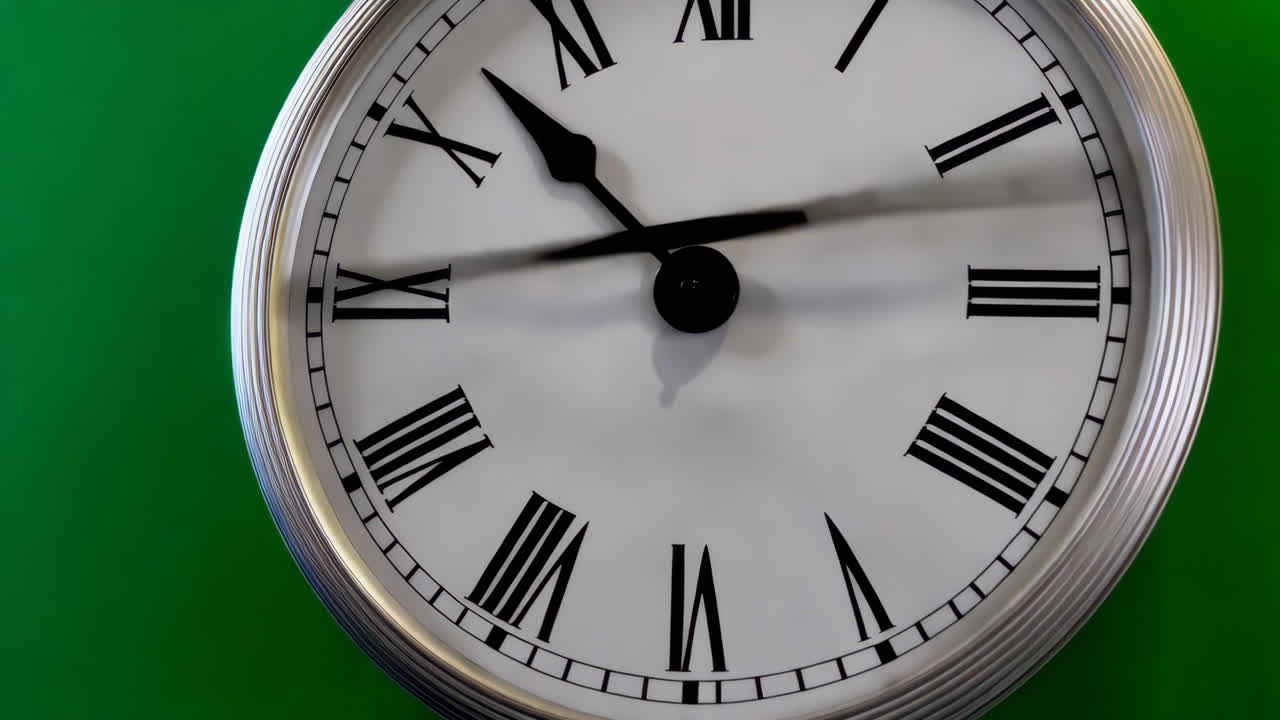 Close-up of a wall clock with roman numerals