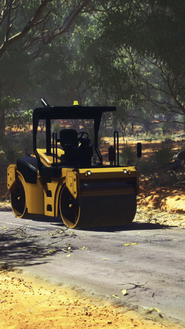 Heavy machinery performs road construction in a serene forest setting