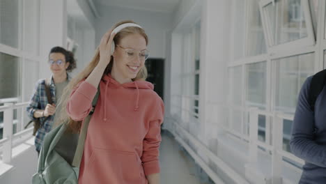 students enjoying a walk in the college hallway.