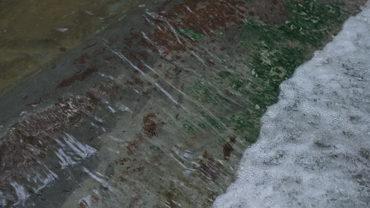 Water flowing over a concrete pipe