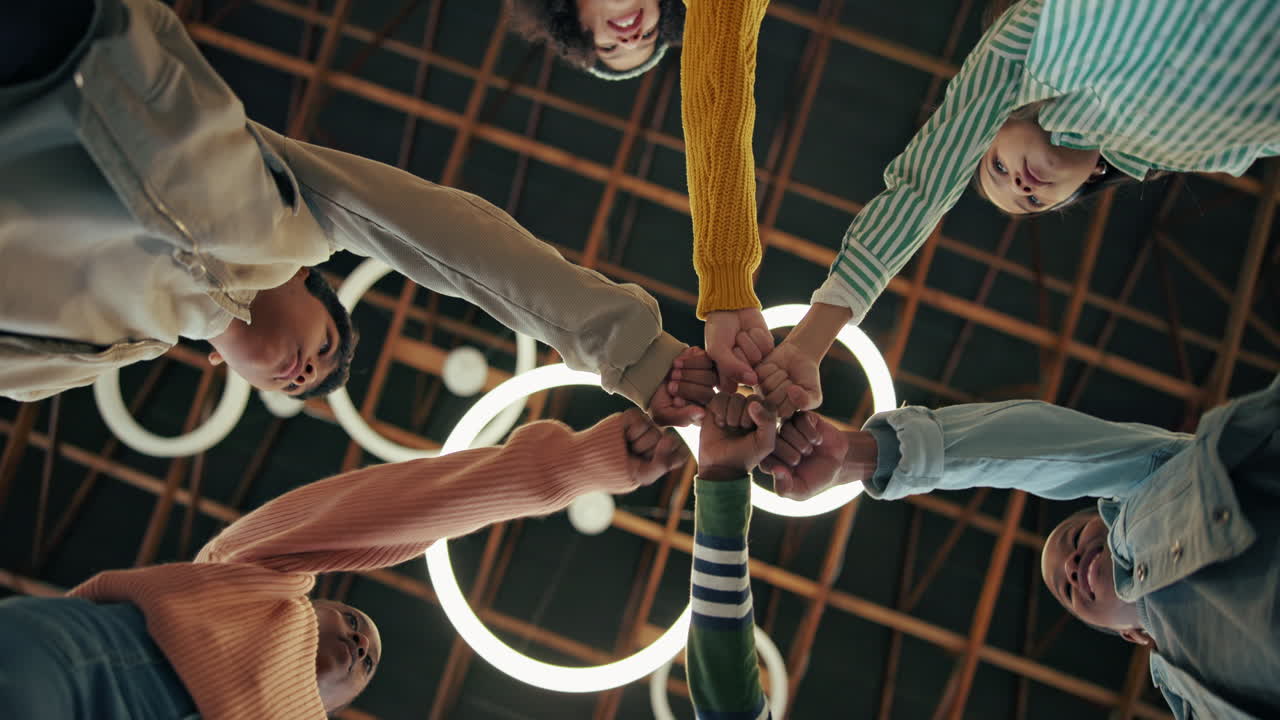 Group of people doing a fist bump
