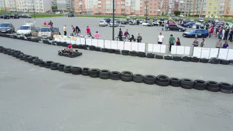kart outdoor race. vinnitsa, ukraine - may 2017: europe day, kart drivers moving on a go kart track