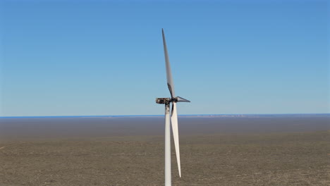 close aerial view of a burnt windmill still moving its blades