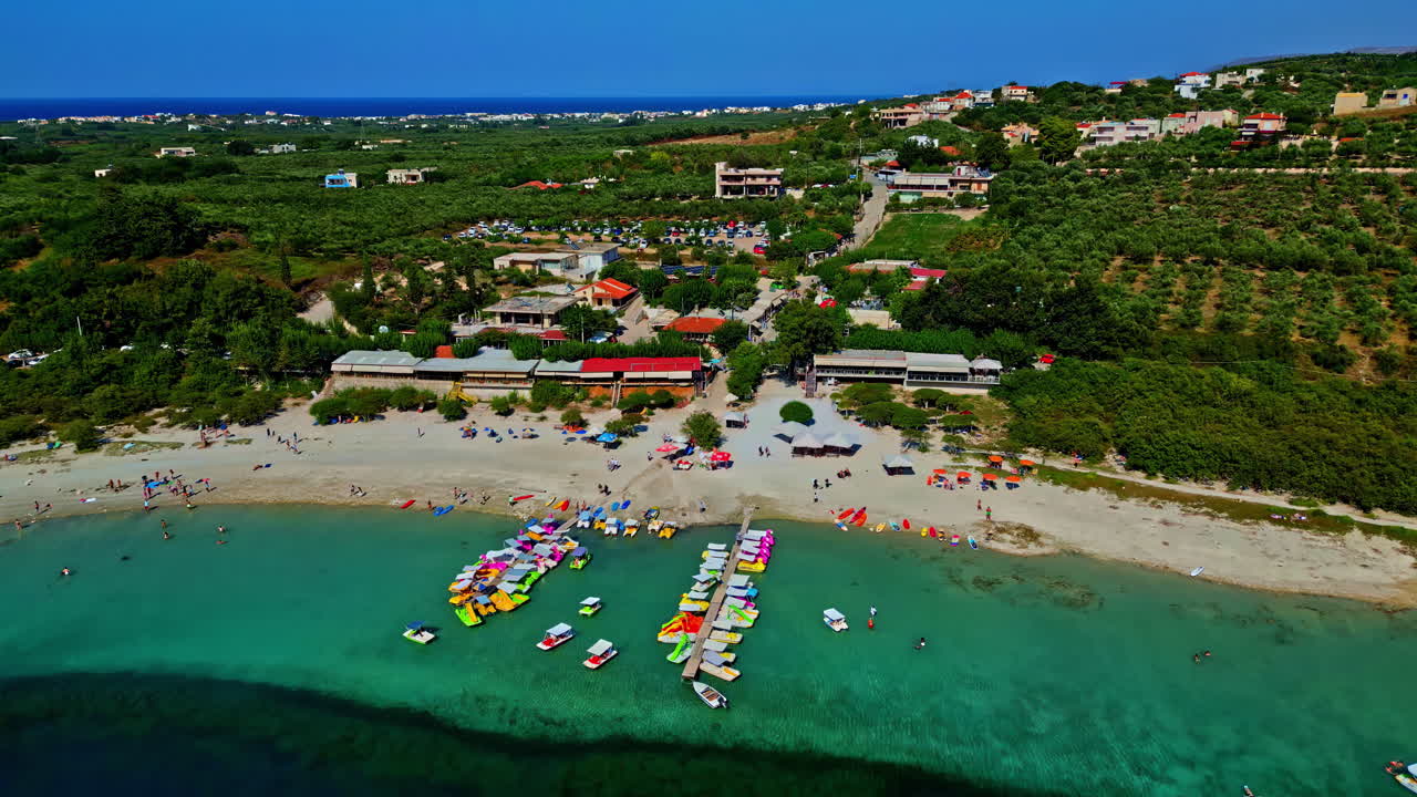Amazing aerial drone shot of Lake Kournas in Crete, Greece. With its turquoise waters, and its tourist beaches