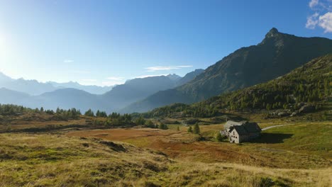 -Valmalenco-Alps-Meadow-Landscape-With-Cottage-Building-In-Background