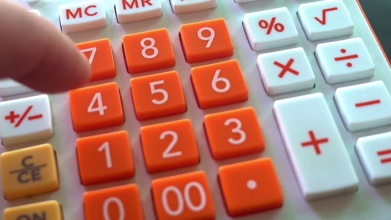Man's Fingers Pressing Buttons on an Orange and White Calculator Adding Numbers, Close Up Shot
