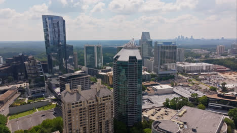 aerial approaching shot of with modern skyscraper in buckhead, atlanta