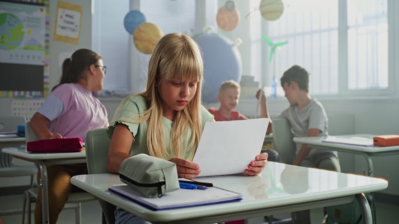 Students in a classroom taking an exam