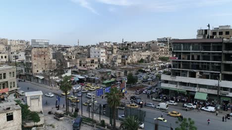 view of the living streets of aleppo in syria. we can see people walking and cars driving on the roads - aerial view with a drone 4k