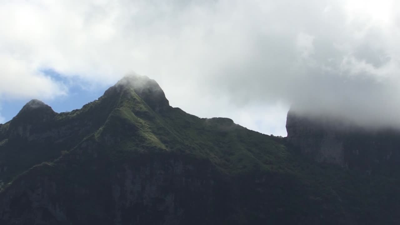 Peak of mount Otemanu covered by the clouds in Bora Bora, French Polynesia.