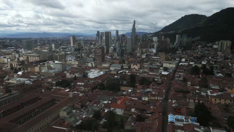 aerial footage of bogota colombia capital city with historical city center downtown and modern skyscraper office buildings