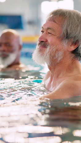 senior man enjoying a relaxing swim in the pool