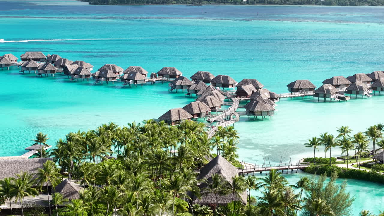 Drone Shot of Luxury Tropical Resort on Bora Bora Island, French Polynesia, Bungalows and Turquoise Lagoon