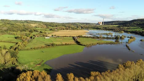 british countryside wet flooded fields - meadows after river bursts banks submerging fields