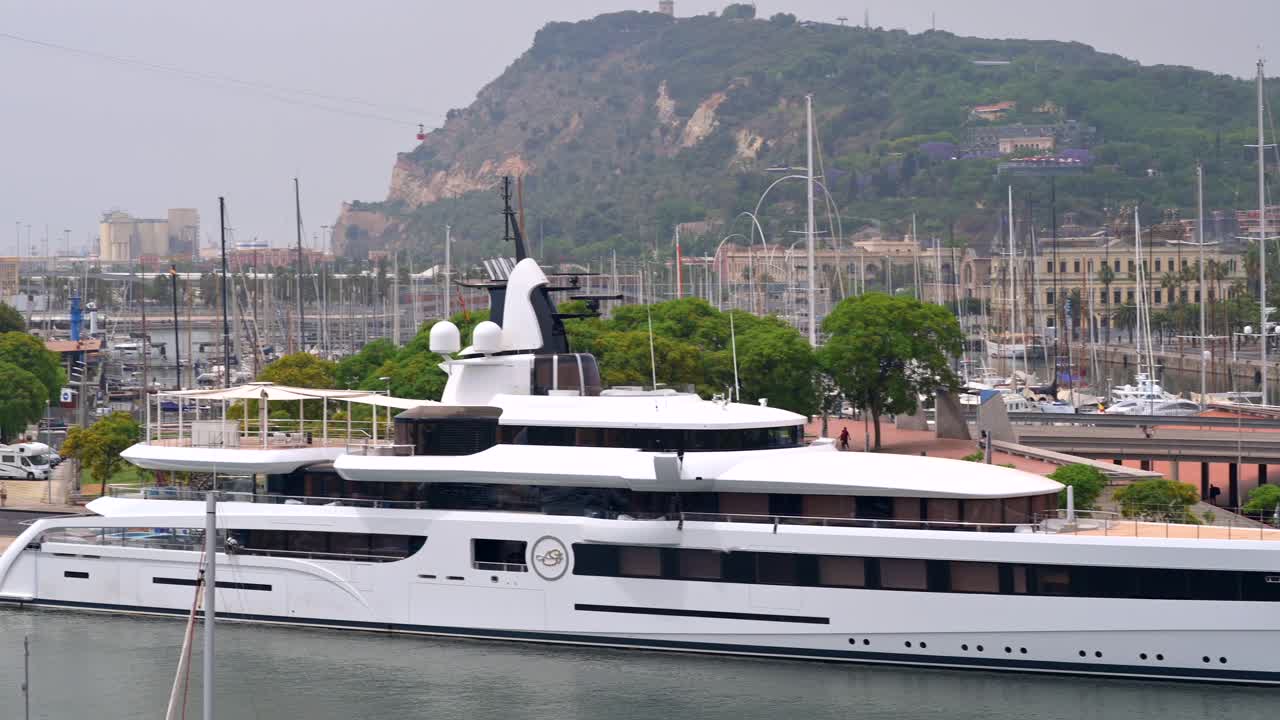 Aerial drone view of boats docked in the Port Vell in Barcelona, Spain