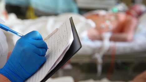 Doctor-filling-out-a-death-certificate-after-a-critically-ill-patient-died-in-the-emergency-department