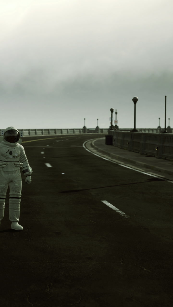 Astronaut strolls on an empty road by the seaside on a misty day