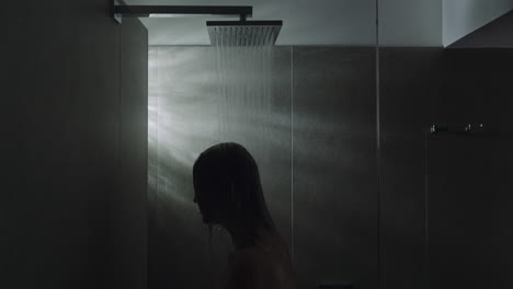 woman taking a shower side view