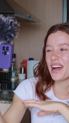 woman vlogging in kitchen