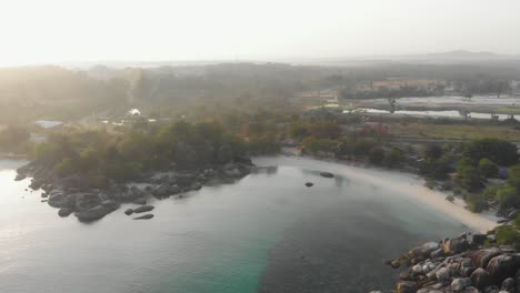 Wide-view-of-Tanjung-Tinggi-Beach-at-Belitung-Indonesia,-aerial