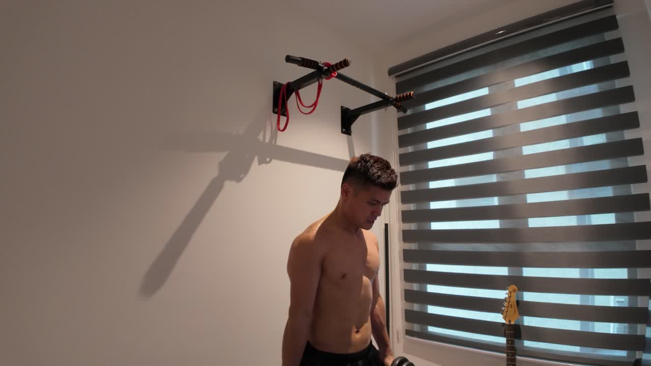 Man doing dumbbell hammer curl at home (Slowed)
