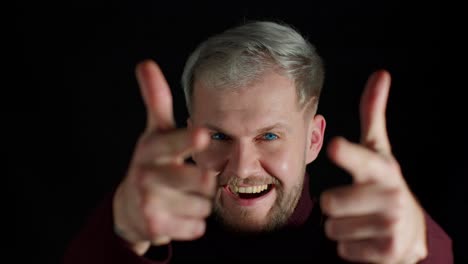 glad happy stylish young man smiling excitedly and pointing to camera, beauty choosing lucky winner