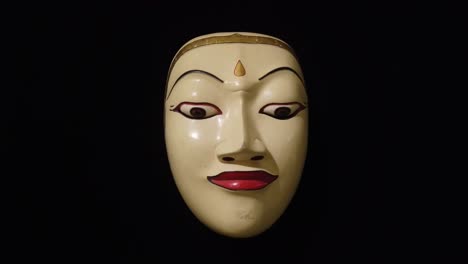 Traditional-Wood-Carved-Topeng-Mask-of-Balinese-Hinduism-Theater,-Bali-Indonesia-Closeup,-Black-Background