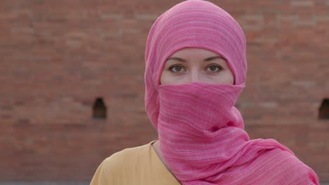 woman wearing a pink hijab