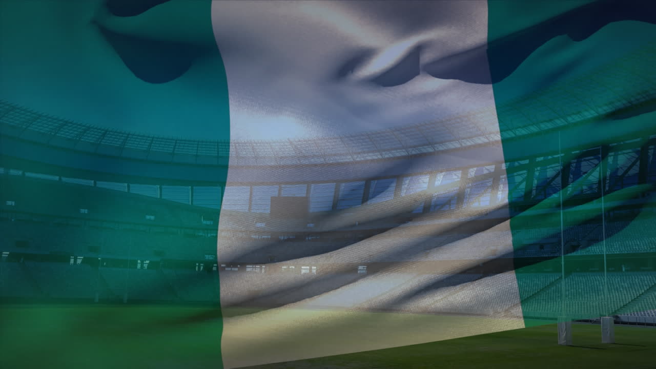 bandera ondeando frente a un estadio