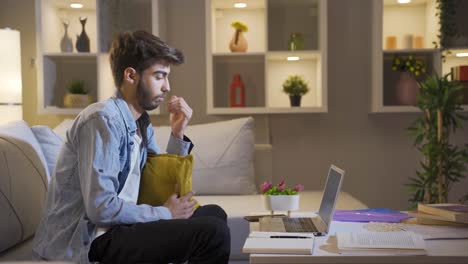 man getting tired while using computer at night.