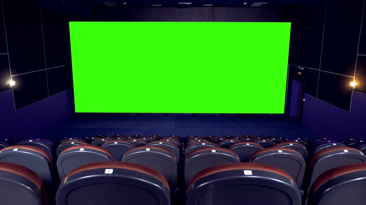 Blank green Screen in the cinema house.