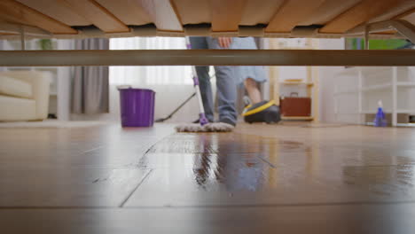 mopping under sofa