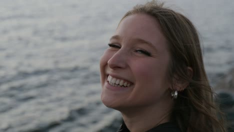 Charming-Young-Girl-Relaxing-At-The-Beach-In-Magog,-Quebec,-Canada