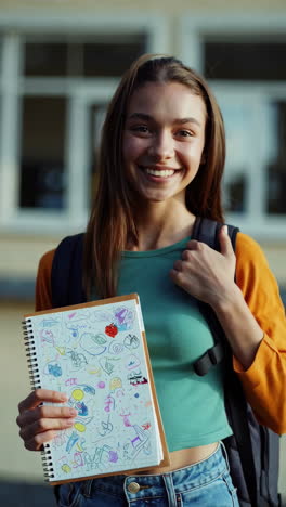 teenage girl with a notebook