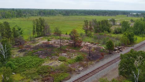 vegetation fire around a rocky area that caught a spark from surrounding wildfires in canada