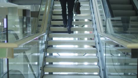 businessman on climbing the stairs. strait shot.