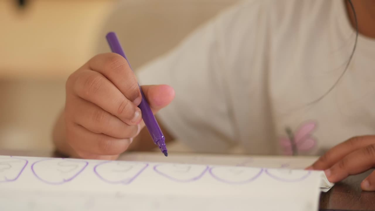 Child Drawing with Purple Marker