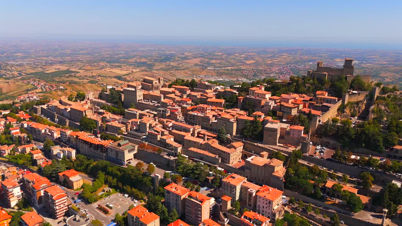 Witness the breathtaking aerial beauty of San Marino, with its iconic towers and picturesque countryside.