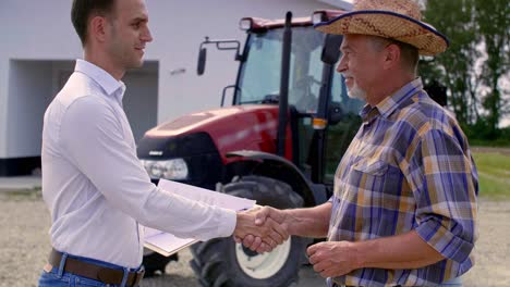 business partners shaking hands on the farm