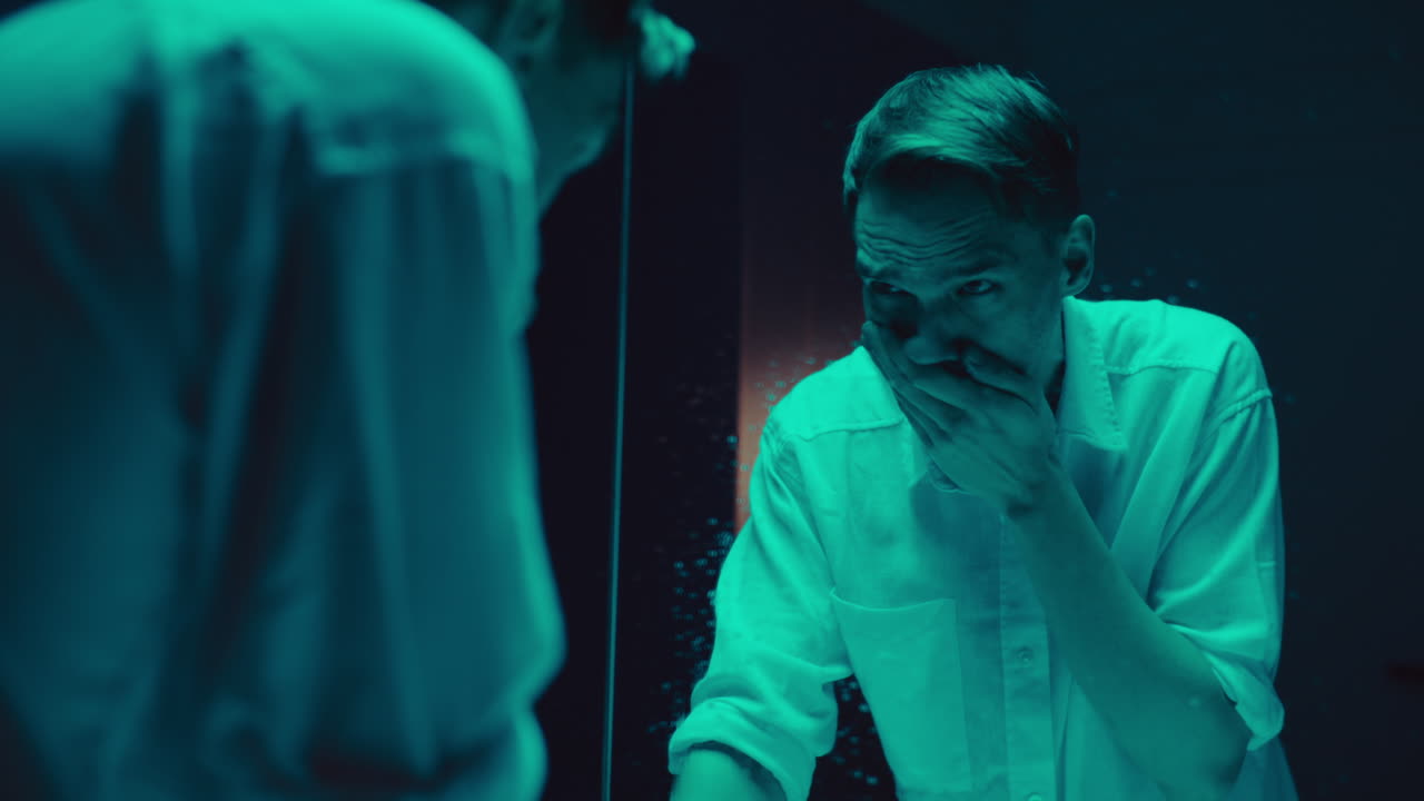 Man Looking in Mirror with a Shocked Expression