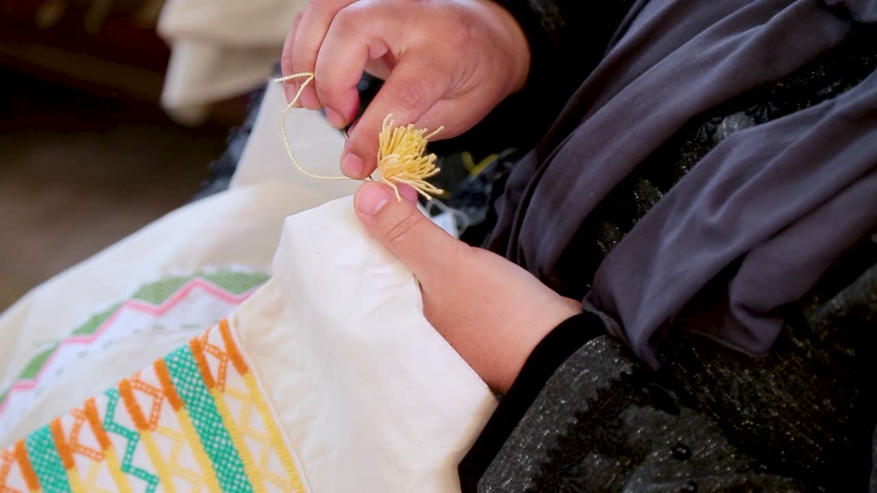 old women handmade sewing old traditional pillow