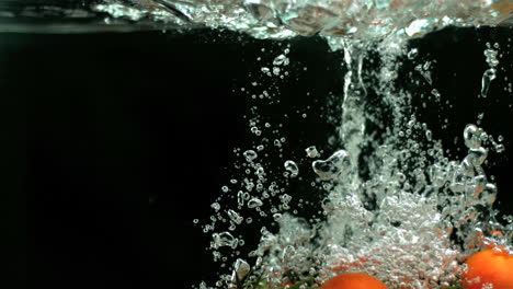 vine tomatoes falling into water